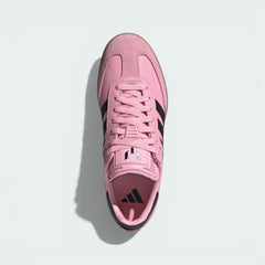 Top-down view of the Inter Miami edition boots, highlighting the pink leather upper, suede T-toe, and the Messi logo on the tongue.