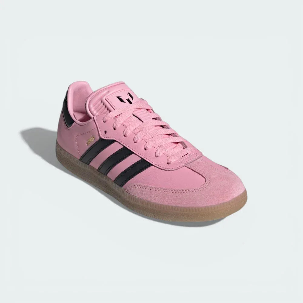 Angled shot of the Samba Messi boots, showcasing the vibrant pink colourway and the premium materials.