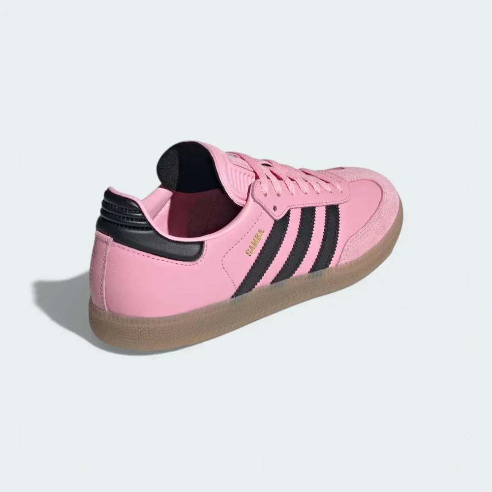 Rear view focusing on the clean pink heel tab and the streamlined construction of the indoor football boots.
