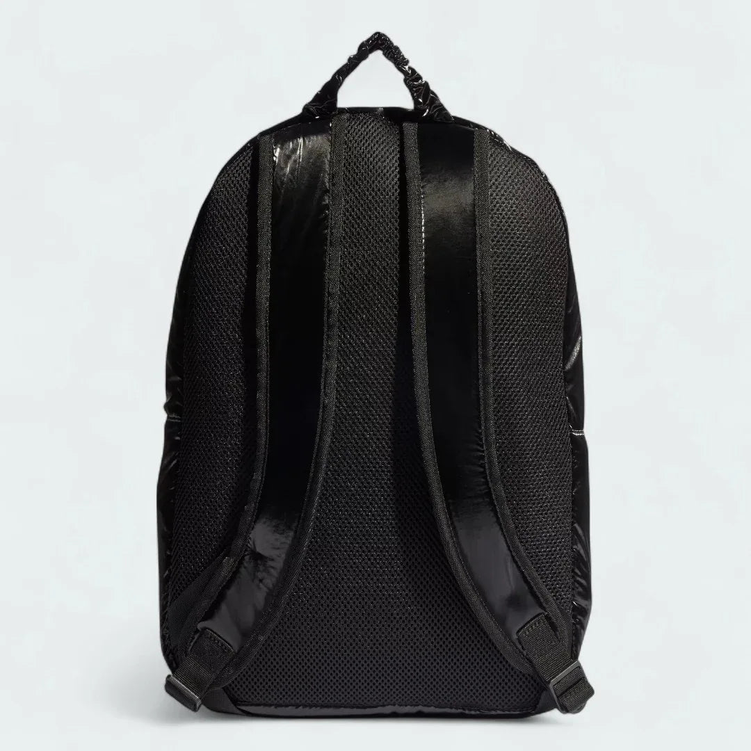 Adidas Puffy Satin Backpack in black, back view showing the adjustable shoulder straps and textured back panel.