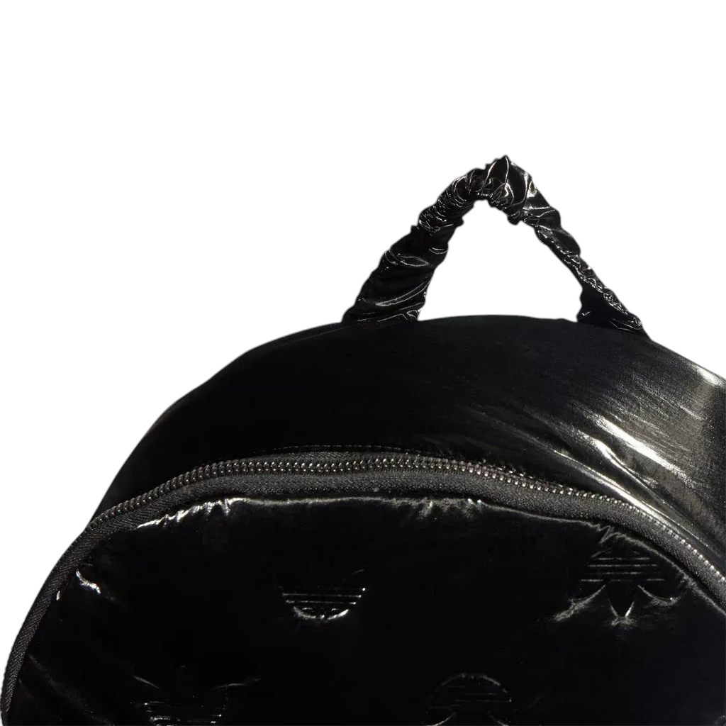 Adidas Puffy Satin Backpack in black zoomed in showing the zip and carry handle