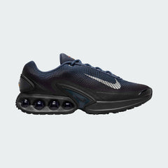 Nike Air Max DN Men's running shoes in dark navy with white accents, side profile showing visible Dynamic Air unit in the heel, textured upper, and sleek silhouette.