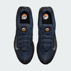 Top-down view of a pair of Nike Air Max DN Men's running shoes in dark navy, highlighting their futuristic design and lace-up closure.