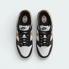 Top-down view of the trainers, highlighting the perforated white toe box and the contrasting black lacing system.