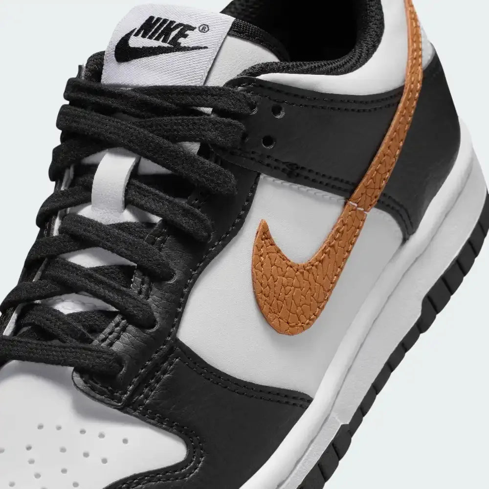 Close-up of the front, showing the quality of the white leather toe box and the secure black eyelets.