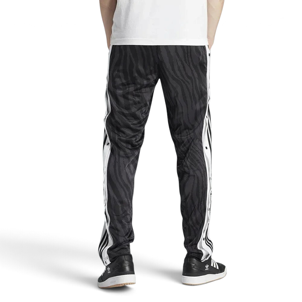Adidas Adibreak Button Track Pants in black, back view showcasing the tapered leg and tonal animal print.
