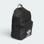 Highlights the high-velocity sweep of the padded shoulder straps, showing the professional, tight weave of the black recycled canvas body and the open utility side pockets sitting flush on the flanks.