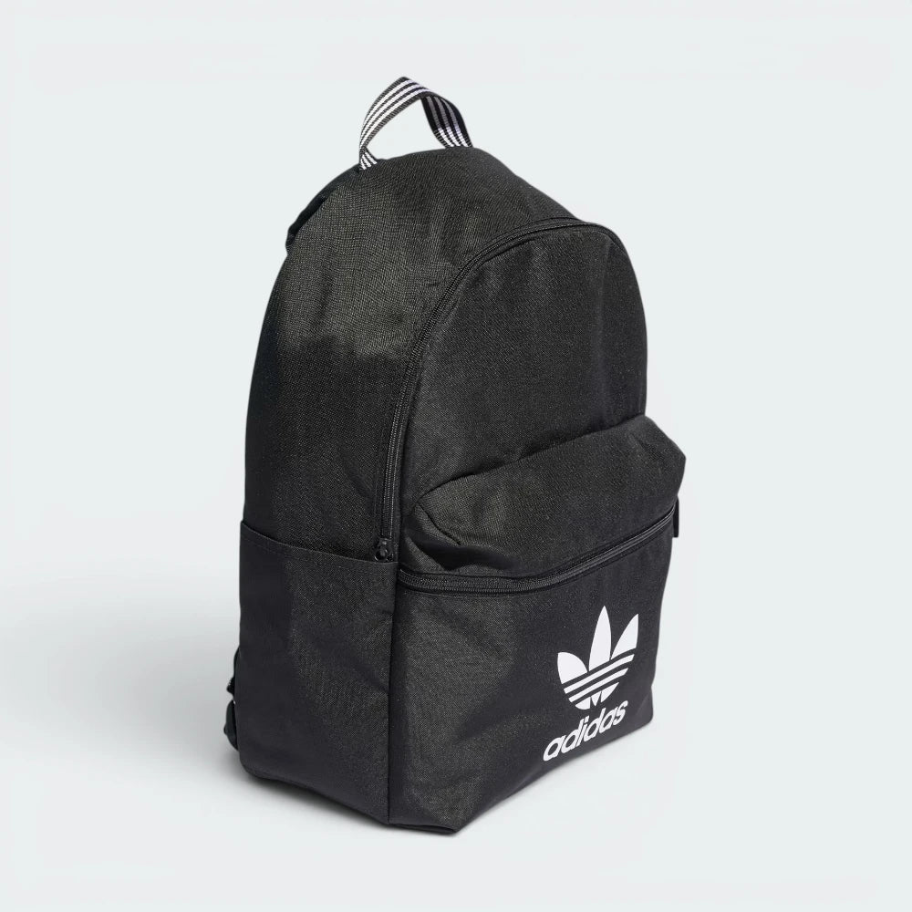 Highlights the high-velocity sweep of the padded shoulder straps, showing the professional, tight weave of the black recycled canvas body and the open utility side pockets sitting flush on the flanks.