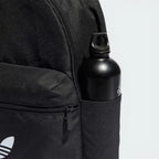 Details the premium twin-needle stitching tracking around the front zip pocket compartment, framing how the custom metal pull tabs slide smoothly under tension.