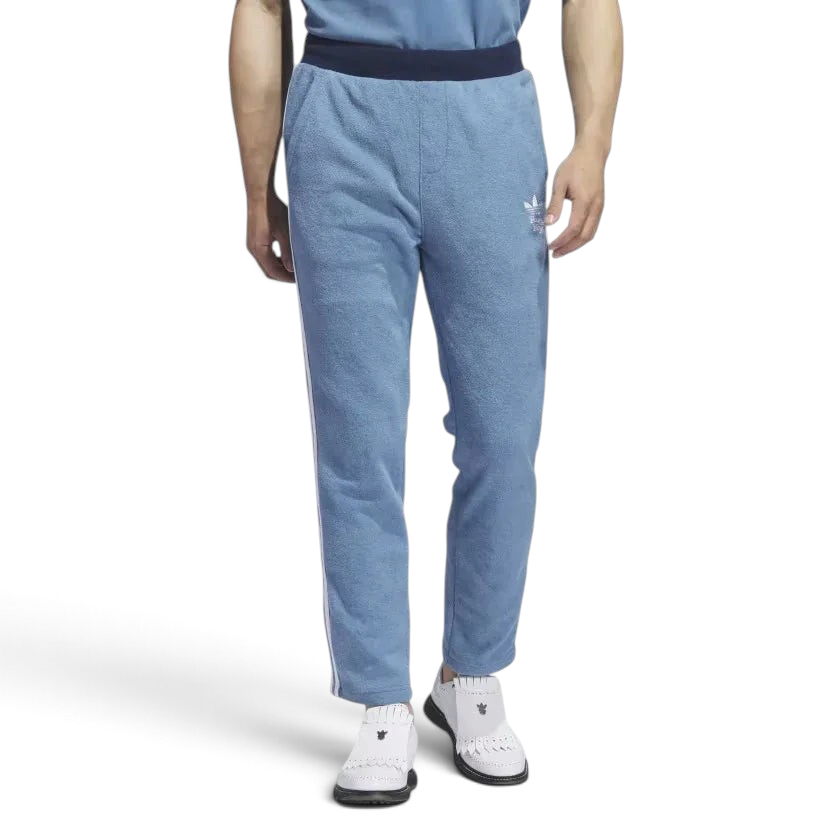Adidas x Bogey Boys Golf Men's Track Pants in blue, front view showing the elastic drawcord waist, side pockets, and Trefoil/Bogey Boys logo on the hip. Main image