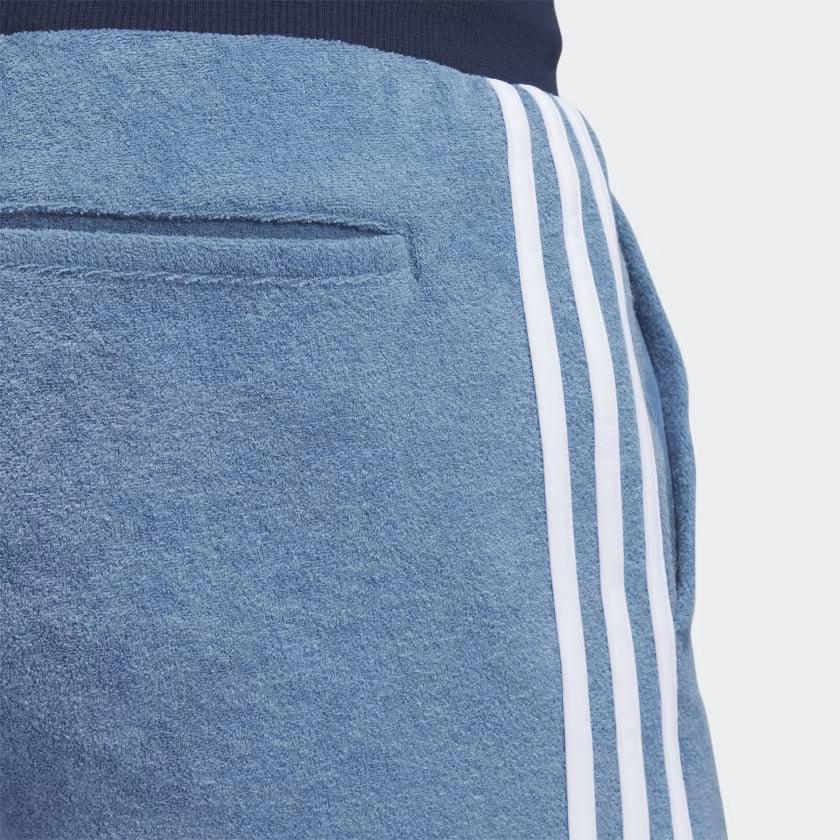 Detailed zoom on the elastic waistband with drawcord or the ankle cuff of the Adidas x Bogey Boys Golf Track Pants, highlighting the adjustable fit and clean finish.