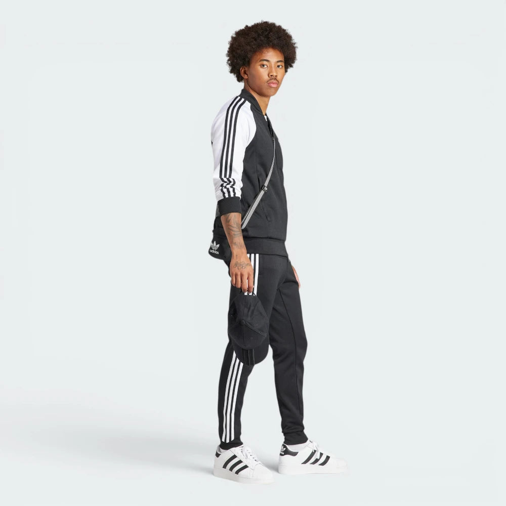 Emphasising the sharp visual contrast of the white fabric bands sewn perfectly parallel down the arm columns.