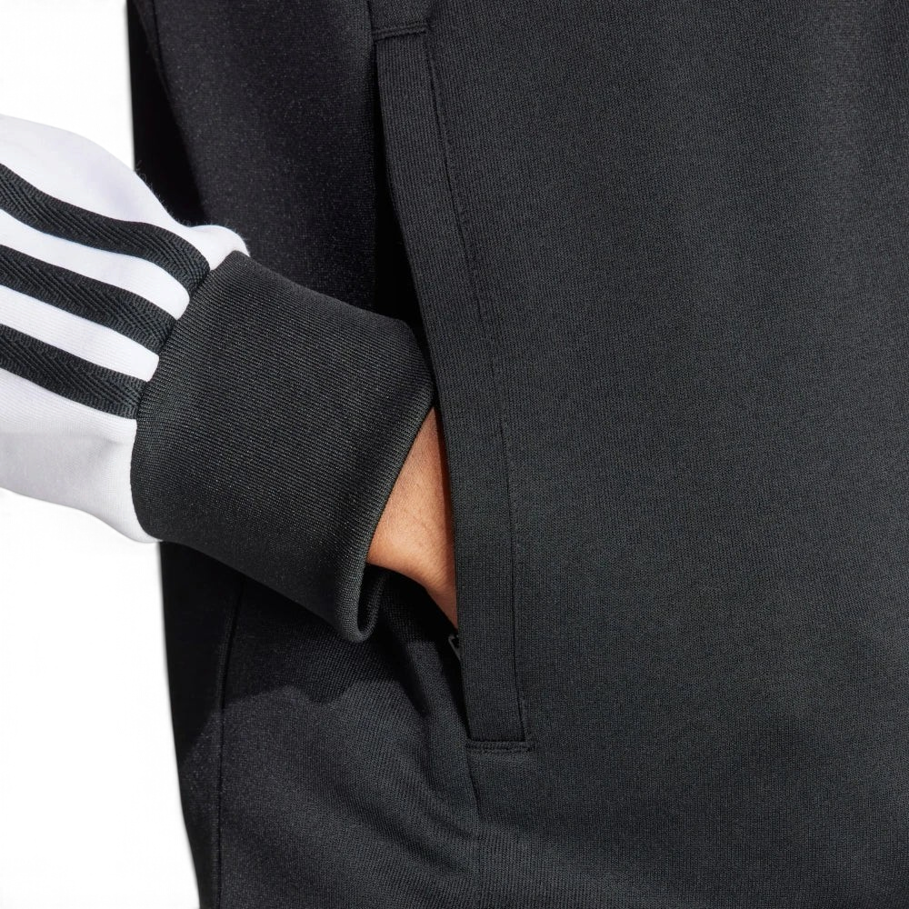 Emphasising the sharp visual contrast of the white fabric bands sewn perfectly parallel down the arm columns.