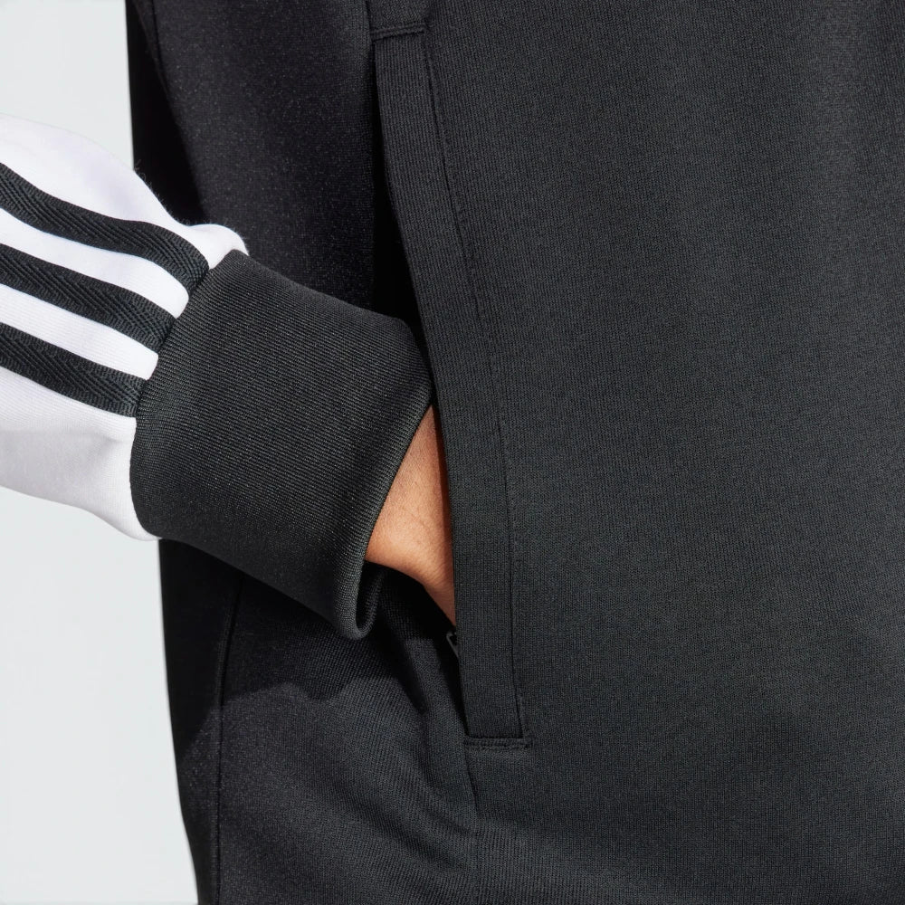 Emphasising the sharp visual contrast of the white fabric bands sewn perfectly parallel down the arm columns.