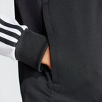 Emphasising the sharp visual contrast of the white fabric bands sewn perfectly parallel down the arm columns.
