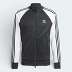 Black and white Adidas tracksuit jacket on a light gray background