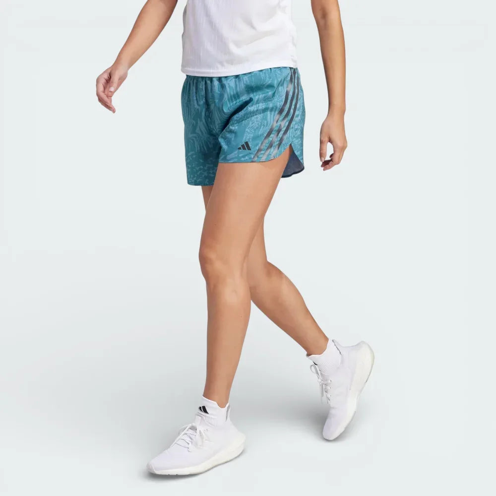 Side profile of the Adidas Run Icons Women's shorts, showing the Arctic Fusion all-over print and the classic white 3-Stripes running down the leg. Main image