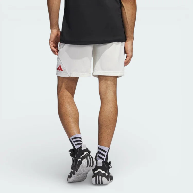 White adidas Badge of Sport Basketball shorts looking from behind showing the red embroided logo on the leg