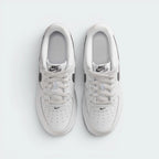 Focuses on the locked-in traditional lacing layout, displaying the perfect symmetry of the textile tongue, the branded tongue tab, and the neat rows of perforations guarding the front toe box area.