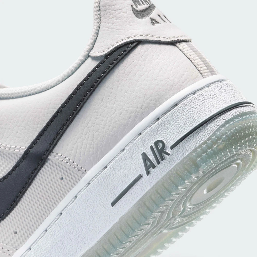 Highlights the "unreal" clean finish where the high-walled rubber cupsole midsole bonds securely to the tough leather upper framework.