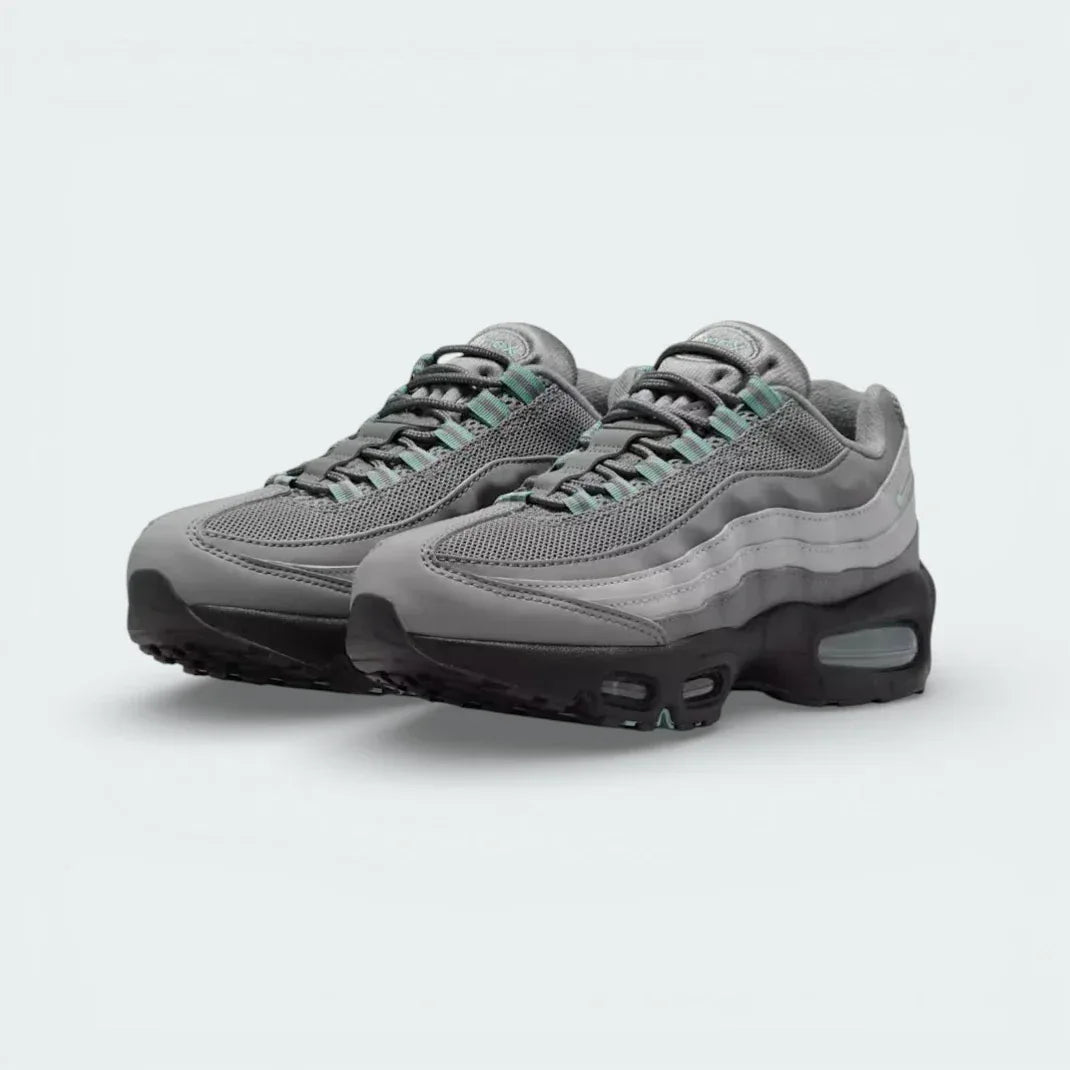 Captures the transition of the Smoke Grey gradient and Cannon blue hits.