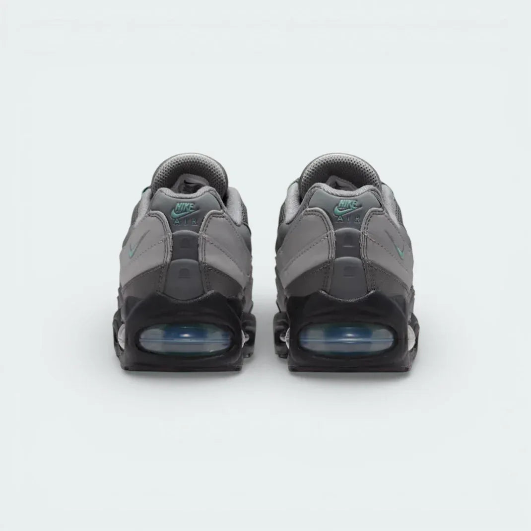 Focuses on the reflective heel tab and the rear Max Air unit.