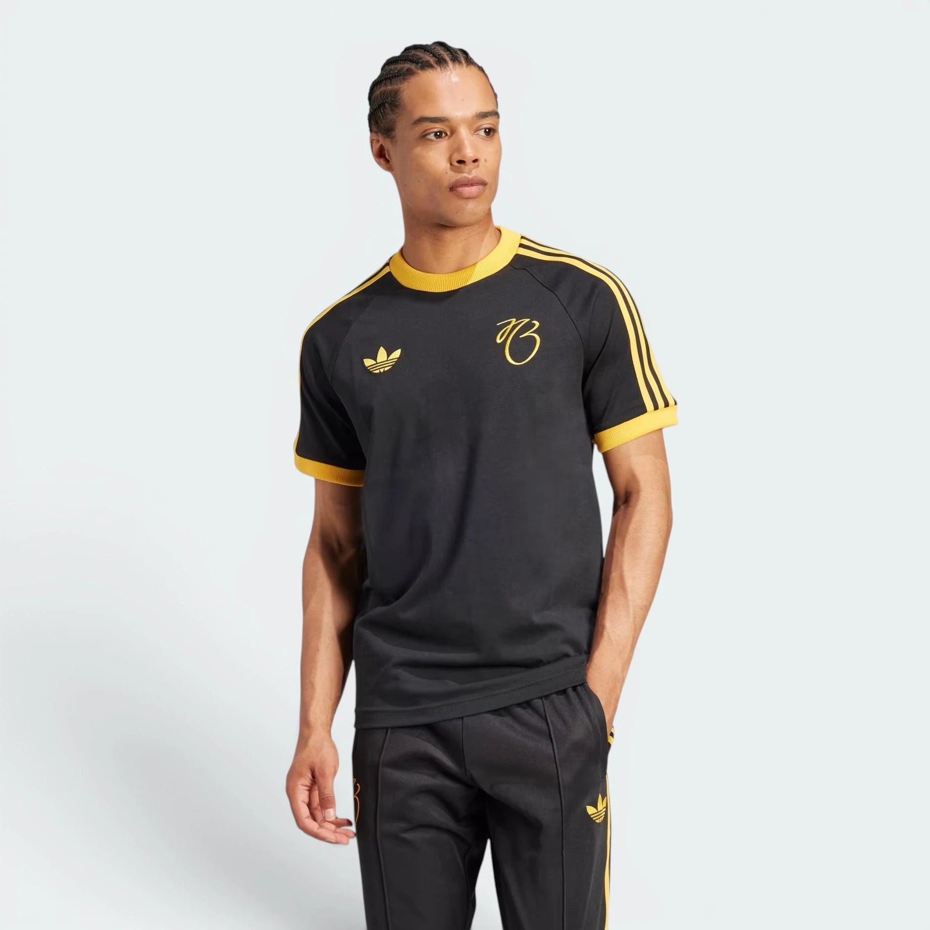 Highlights the high-velocity yellow adidas 3-Stripes running down the sleeves and the professional, slim-fit silhouette.