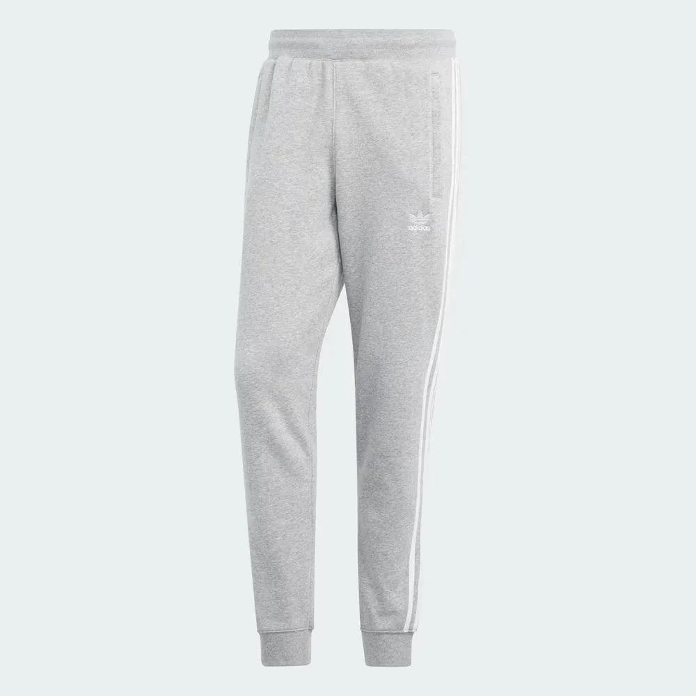 Overhead view of the joggers laid flat, highlighting the elastic waistband, drawcords, and the embroidered Trefoil logo.