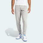 Front profile of the Adicolor 3-Stripes joggers, showing the slim-fit silhouette and the iconic contrast stripes running down 