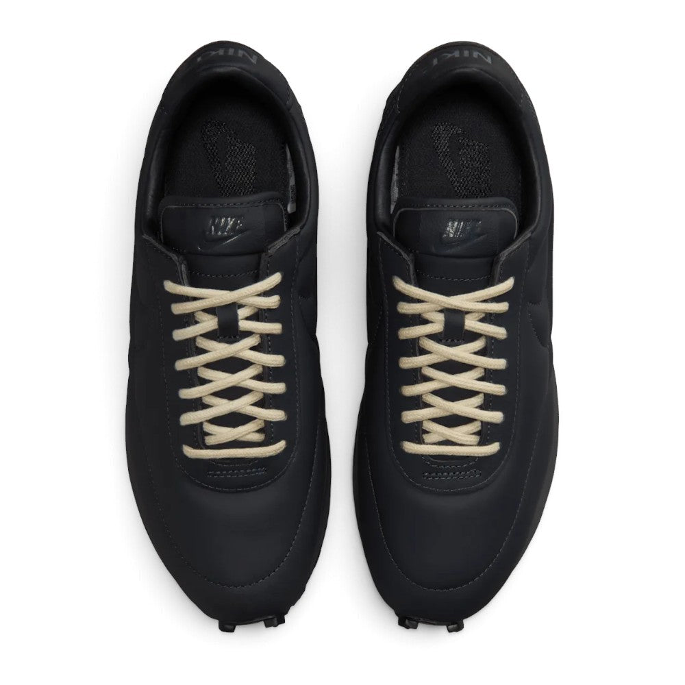 Highlighting the symmetrical central lacing throat, flat tonal laces, vintage-treated foam tongue with classic Nike branding tab, padded collar lining, and cushioned dark sockliner, demonstrating the upper template constructed for a comfortable "locked-in" fit.