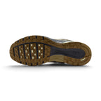 Displays the full-length rubber outsole, showcasing the multi-pod waffle traction pattern, grooved forefoot flex channels, debossed Nike branding, and high-abrasion rubber pods.
