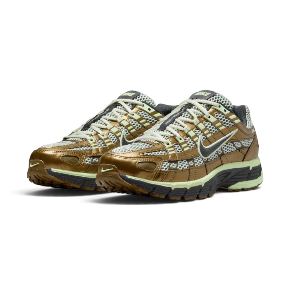 Emphasising the low-slung, technical stance of the trainers and the rich harmony between the earthy Olive Flak mesh base, Jade Aura cage panels, and electric Barely Volt accent details.