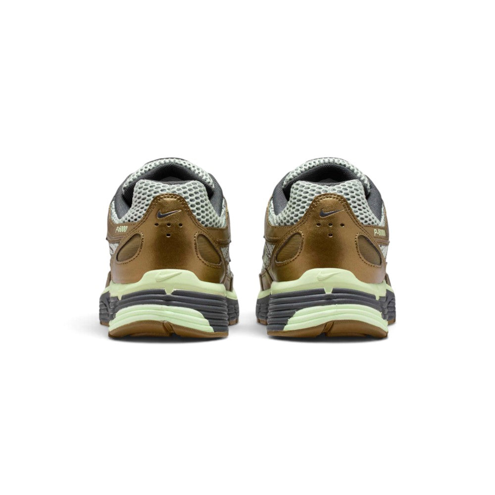 Focuses on the rear profile, displaying the structured synthetic heel counters, micro-Swooshes, ventilation perforations, and the wide base of the ribbed foam midsole