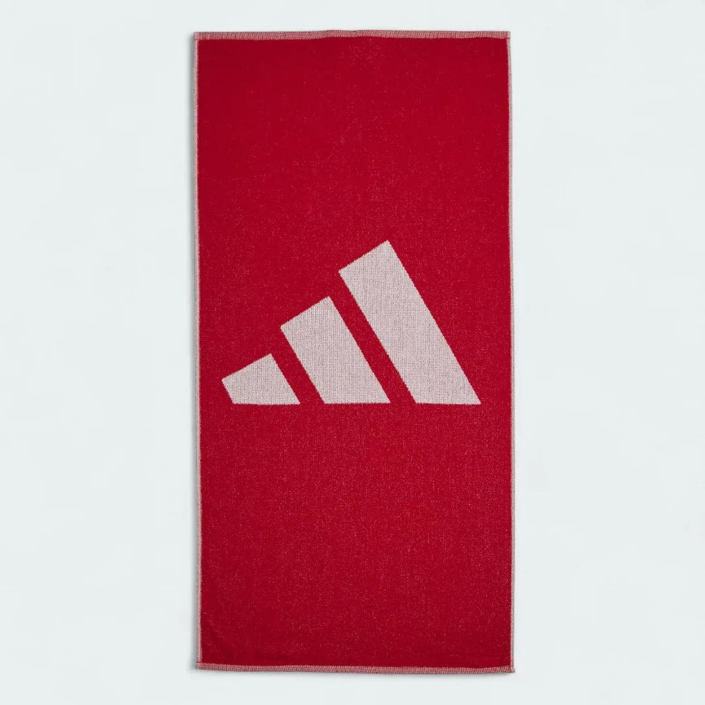 Adidas Cotton Towel in vibrant red, neatly folded, showing the soft cotton texture and Adidas logo.
