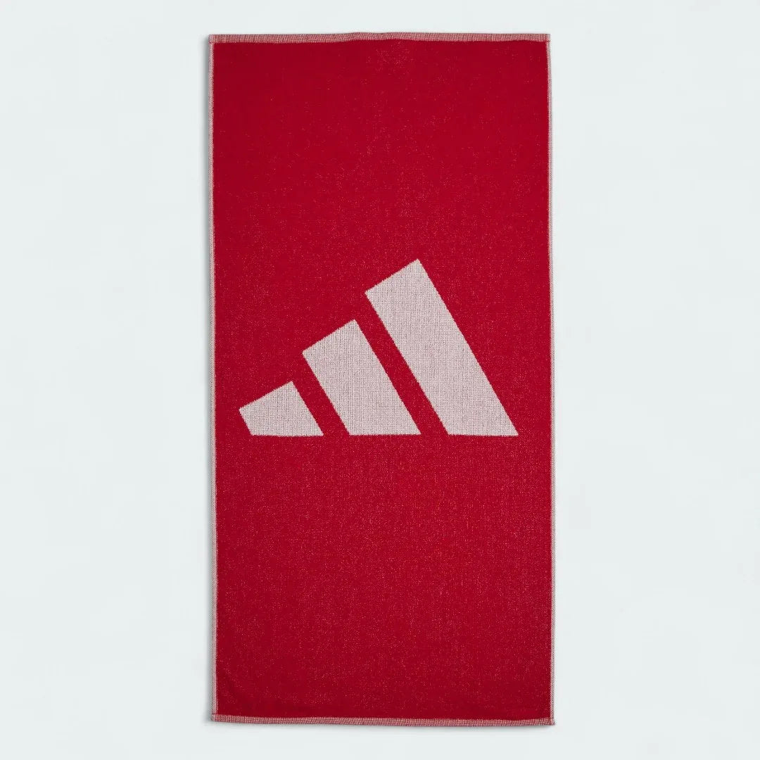 Adidas Cotton Towel in vibrant red, neatly folded, showing the soft cotton texture and Adidas logo.