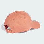 Peach-colored baseball cap on a light gray background