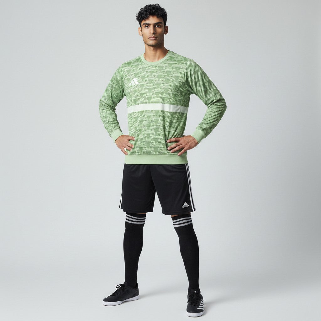 Man wearing the Adidas Handball Goalkeeper Long Sleeve Jersey in green, demonstrating its fit for athletic movement.