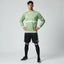 Man wearing the Adidas Handball Goalkeeper Long Sleeve Jersey in green, demonstrating its fit for athletic movement.