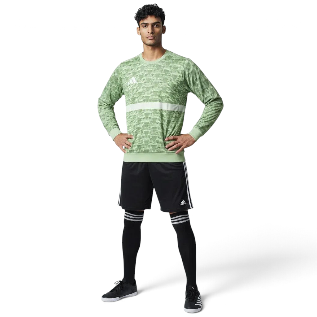 Man wearing the Adidas Handball Goalkeeper Long Sleeve Jersey in green, demonstrating its fit for athletic movement.
