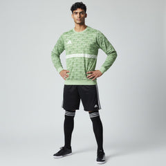 Man wearing the Adidas Handball Goalkeeper Long Sleeve Jersey in green, demonstrating its fit for athletic movement.