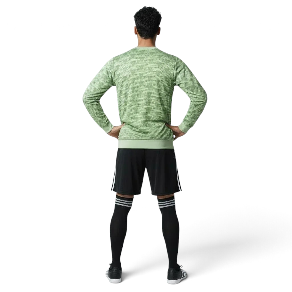Man wearing the Adidas Handball Goalkeeper Long Sleeve Jersey in green, demonstrating its fit for athletic movement.
