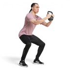 Person performing a kettlebell exercise on a white background