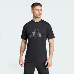 Model profile of the black training t-shirt, showcasing the regular fit and the movement-ready sleeve construction.