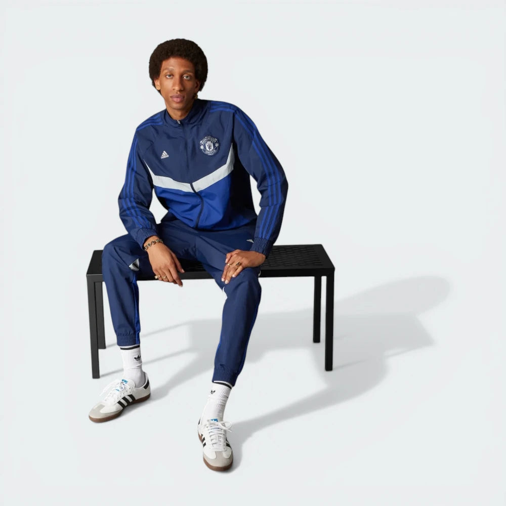 Focuses on the straight fall of the shoulders and the professional finish of the stitched panels.