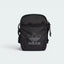 Highlights the high-velocity visual contrast of the white printed Trefoil logo standing proud against the professional, matte-black depth of the ripstop grid texturing.