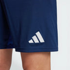 Navy blue shorts with a white Adidas logo on a light gray background