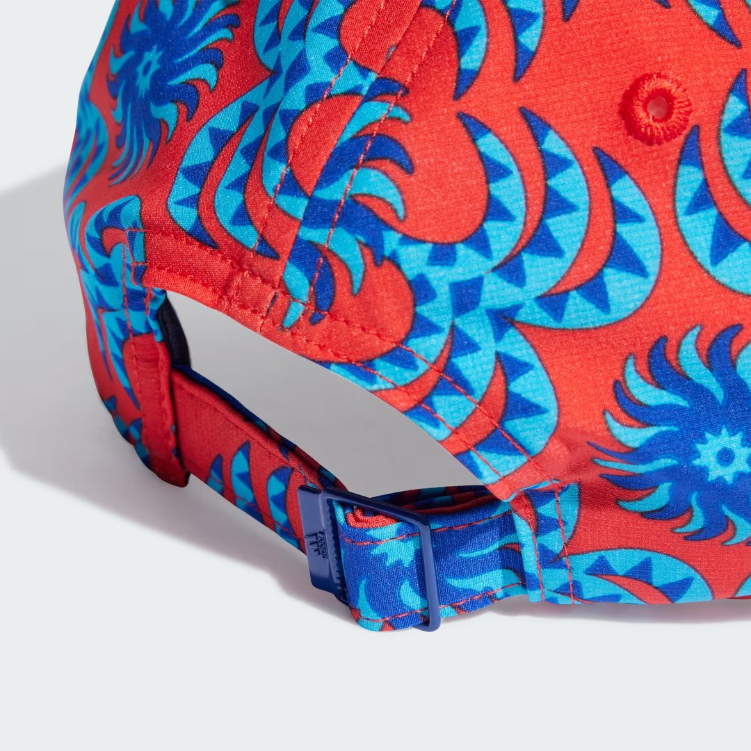 Adidas x Farm Rio cap in a multi-color print, back view showing the adjustable strap and clasp for a customizable fit.