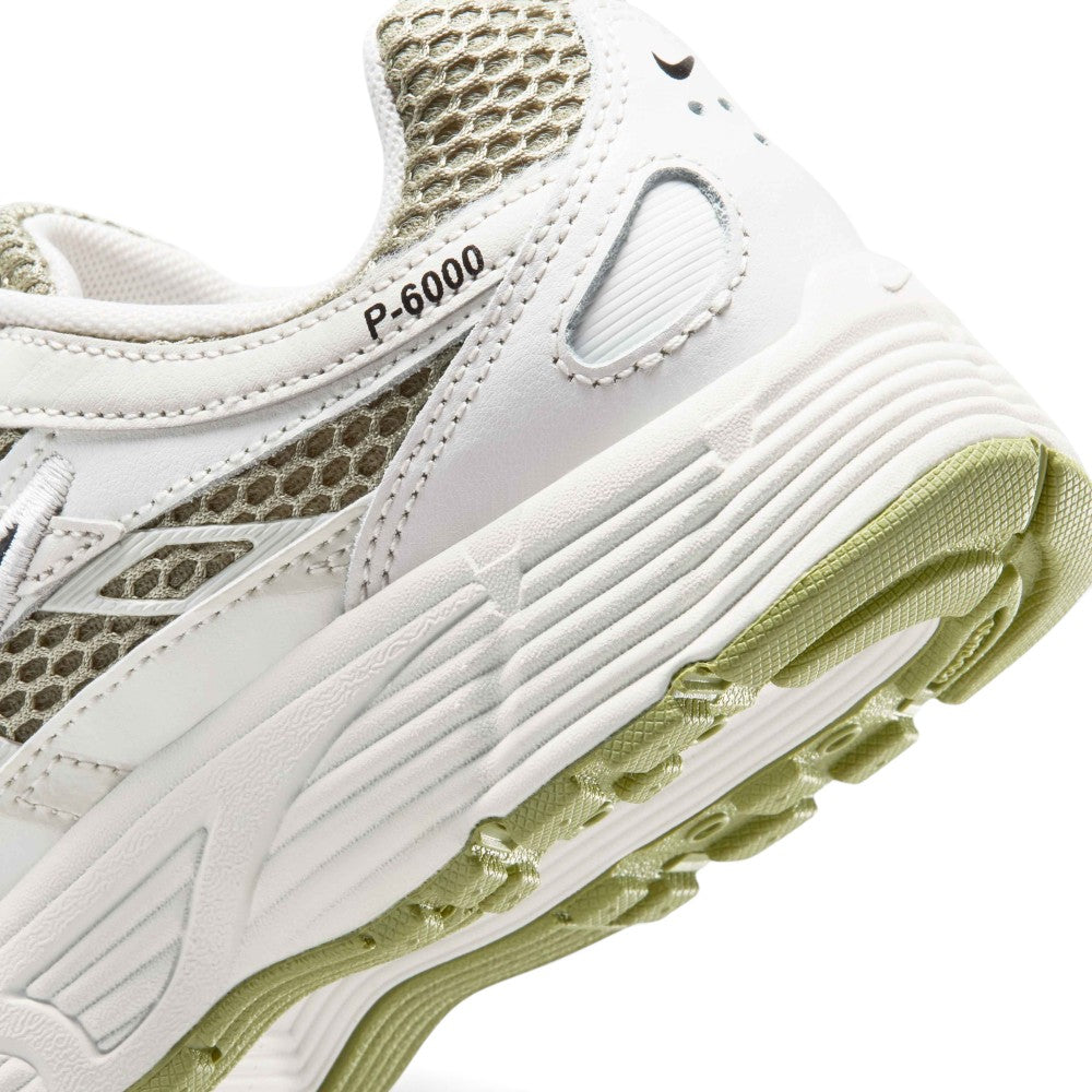 Highlights the "unreal" clean finish where the sculpted Sail foam midsole meets the grooved black rubber outsole tread and olive midfoot cage.