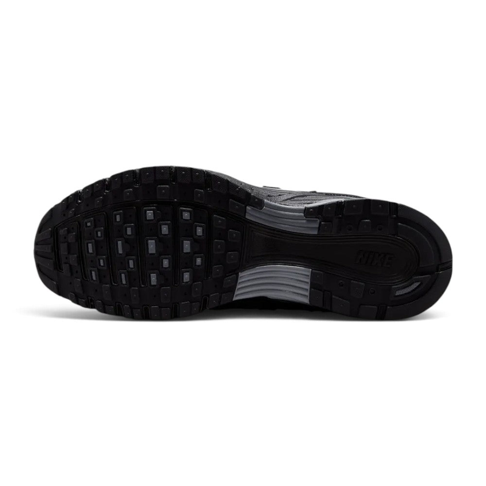 Focusing on the durable full-length black rubber outsole featuring waffle-inspired lug segments, forefoot flex grooves, and Pegasus-inspired traction pods, showcasing the grip matrix engineered for a successful tackle of city pavements, tarmac, and indoor flooring.
