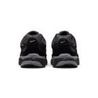 Showing the structured rear heel counter, detailing the layered black leather heel wrap, subtle mini Swoosh embroidery, padded Achilles collar, and sculpted foam heel bevel.
